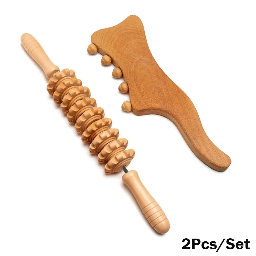 A set of wooden massage tools including a roller massager, a gua sha massager, and a cupping set, displayed on a white background.