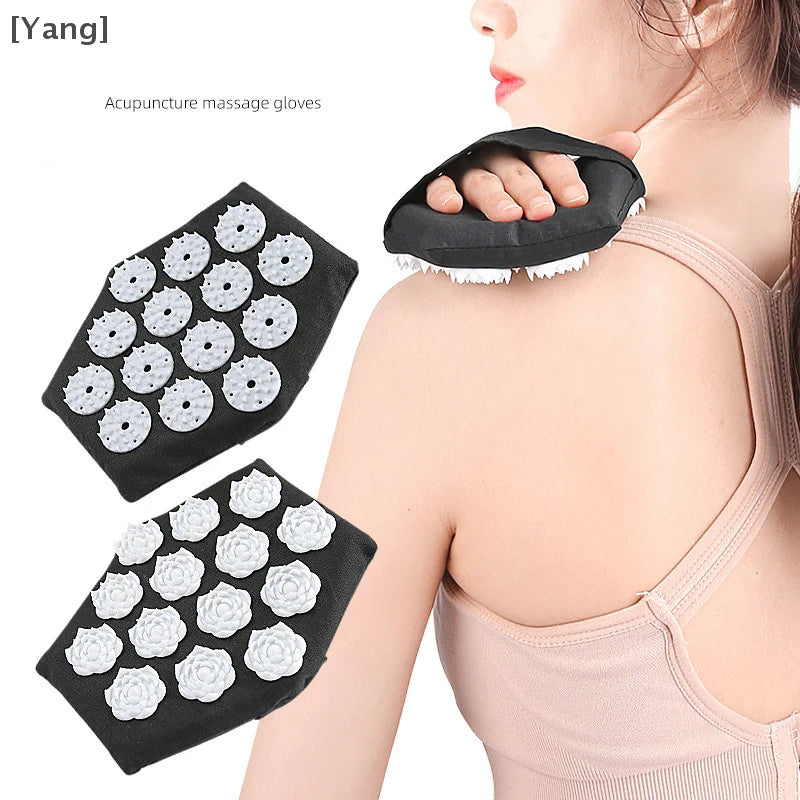 A person is shown using an acupressure massage glove on their back. The glove has a flower-shaped design with raised points, and it appears to be made of black fabric with white accents.