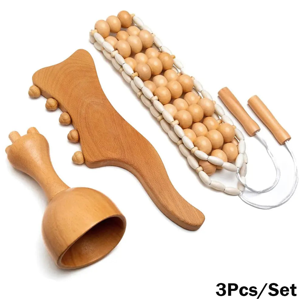 A set of wooden massage tools including a roller massager, a gua sha massager, and a cupping set, displayed on a white background.