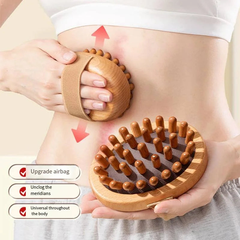 A person using a wooden anti-cellulite massage brush on their abdomen, showing the brush's ergonomic design and bristle pattern.