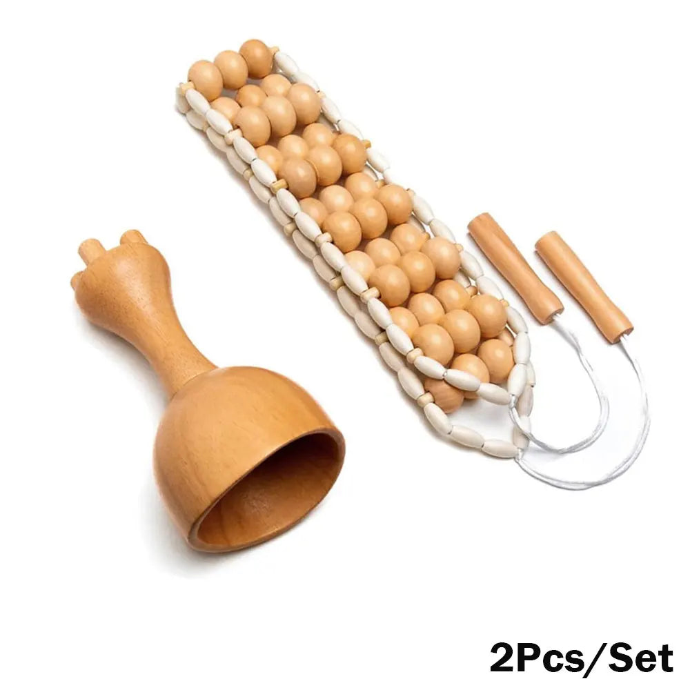 A set of wooden massage tools including a roller massager, a gua sha massager, and a cupping set, displayed on a white background.